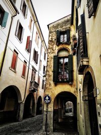 Low angle view of old buildings in town