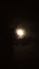 Low angle view of silhouette moon against sky at sunset