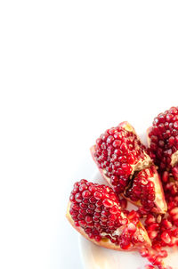 Close-up of strawberry over white background