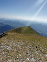 Scenic view of landscape and mountains against sky