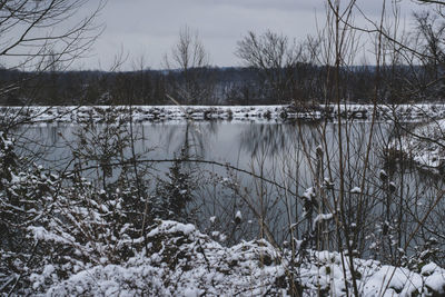 Scenic view of frozen lake against sky