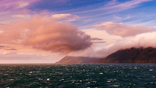 Scenic view of sea against cloudy sky