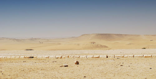 Scenic view of desert against clear sky