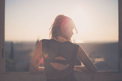 Silhouette of woman at sunset