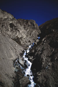 Rock formation on land against sky
