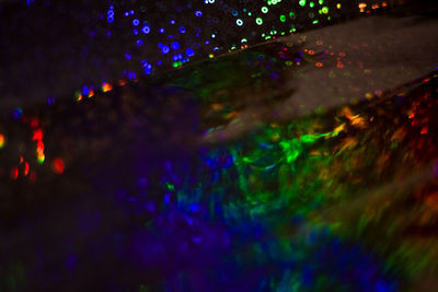 Defocused image of illuminated lights at night