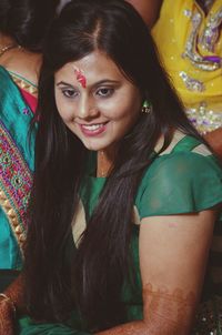 Close-up portrait of smiling young woman