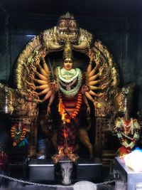 Buddha statue in temple outside building