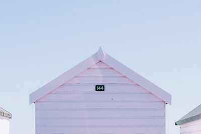 Low angle view of beach hut against sky