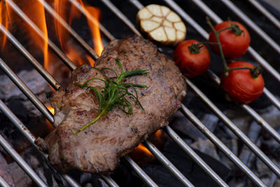 Close-up of meat on barbecue grill