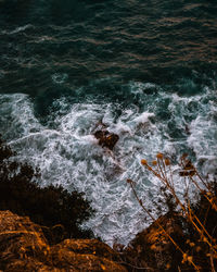 High angle view of rocks in sea