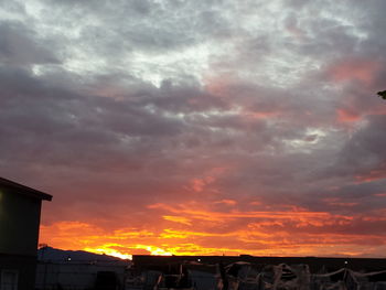 Low angle view of dramatic sky at sunset