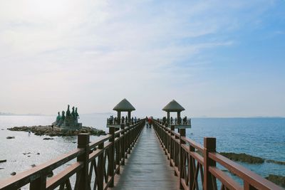 Pier over sea against sky