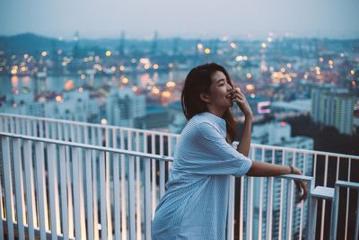 Woman looking at cityscape