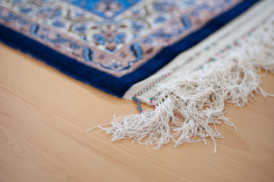 Close-up of carpet on hardwood floor 