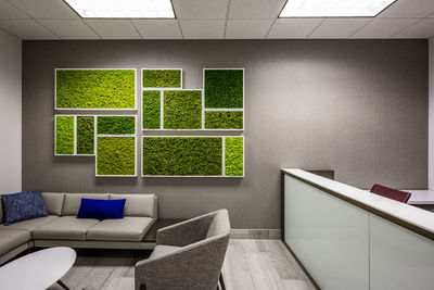 Empty chairs and table against wall at home