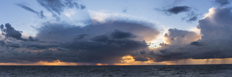 Panoramic view of sea against sky during sunset
