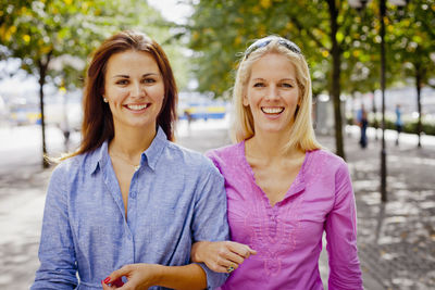 Portrait of two friends in park