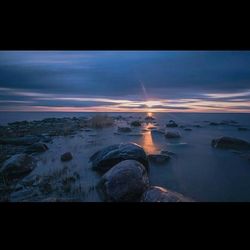 Scenic view of sea at sunset