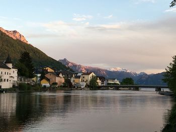 Scenic view of river with mountains in background