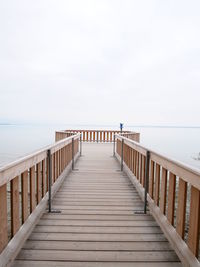 Pier over sea against sky