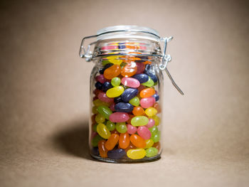 Close-up of multi colored candies in jar