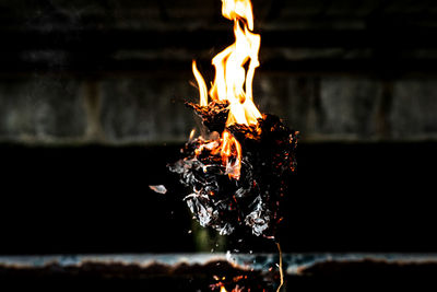Picture of a fire burning paper on the ground