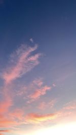 Low angle view of cloudy sky at sunset