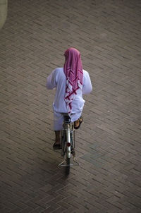 Full length of woman standing by railing