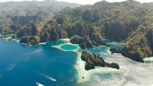 Tourist boats around the beautiful big and small lagoons, aerial view. 