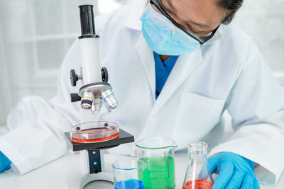 Scientist examining chemical in laboratory