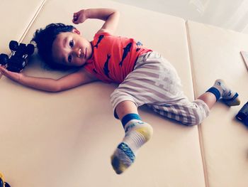 High angle portrait of boy relaxing at home