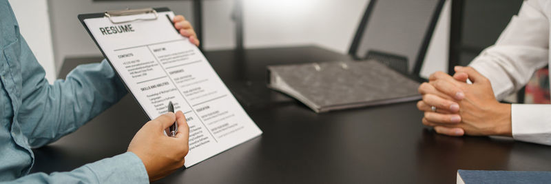 Midsection of business colleagues working in office