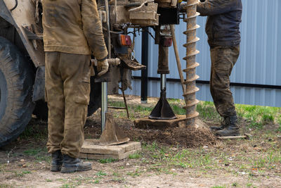 Rear view of man working at construction site