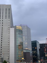 Low angle view of modern buildings against sky