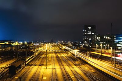 High angle view of railway tracks at night