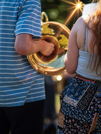 Rear view of people with musical instrument