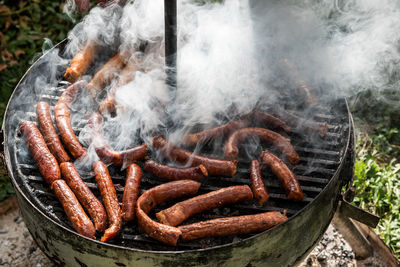 High angle view of hot dog on barbecue grill