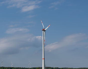 Low angle view of wind turbine against sky