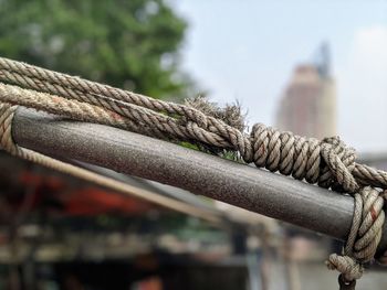 Close-up of rope tied on rusty metal