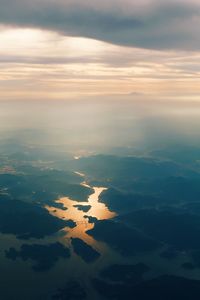 Aerial view of landscape against sky during sunset