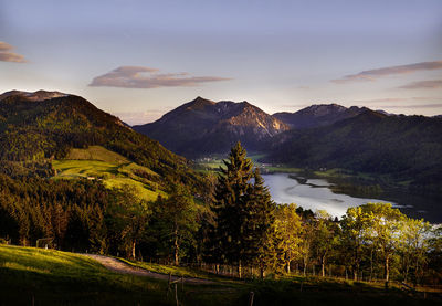 Scenic view of lake and mountains against sky