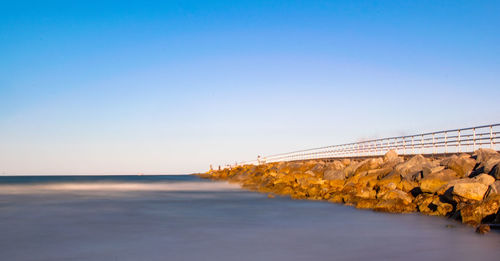 Scenic view of sea against clear sky