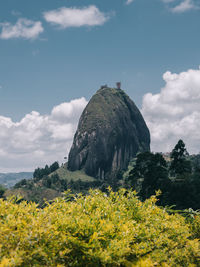 Rock formations on landscape against sky