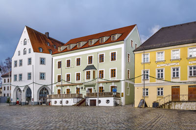 Houses in town against sky