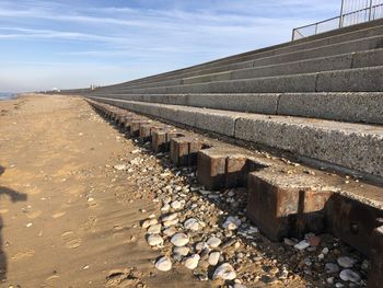 Surface level of railroad track against sky