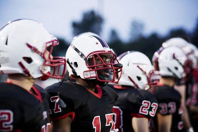 American football team with sports helmet on field