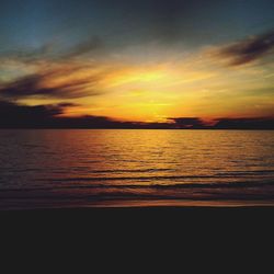 Scenic view of sea at sunset