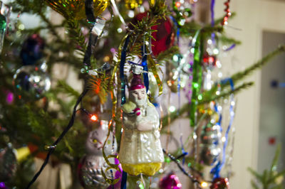 Close-up of christmas decorations hanging on tree