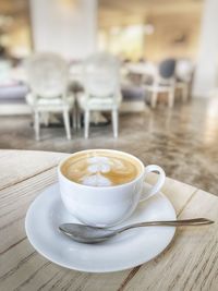 Close-up of cappuccino on table